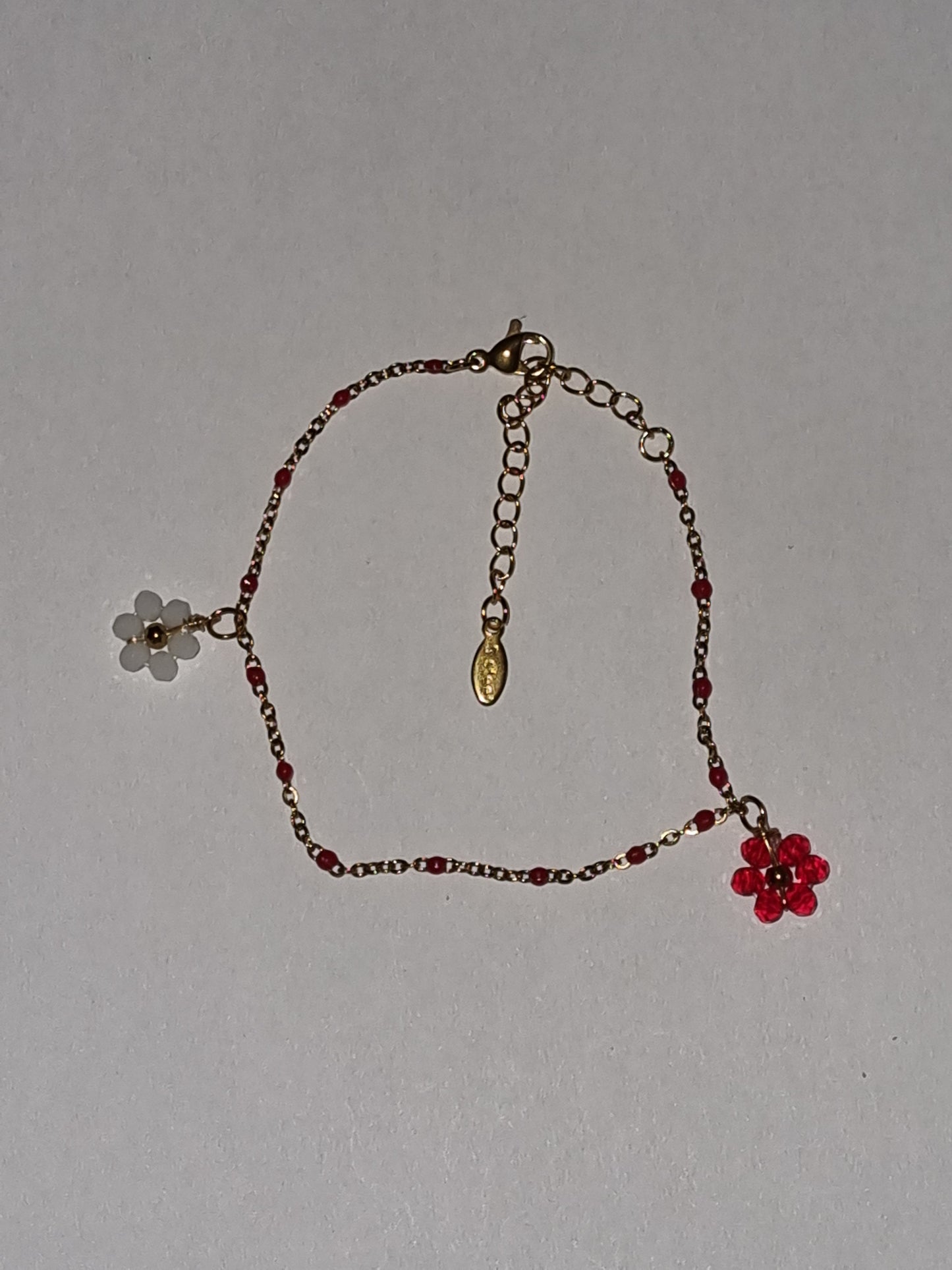 Bracelet fantaisie pampilles petites fleurs perles.